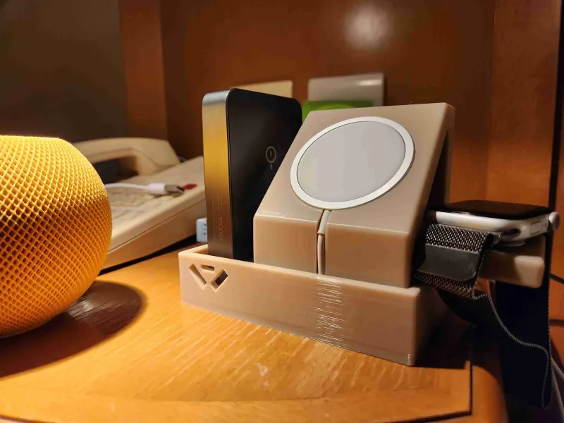 A design to hold and charge your iphone and apple watch